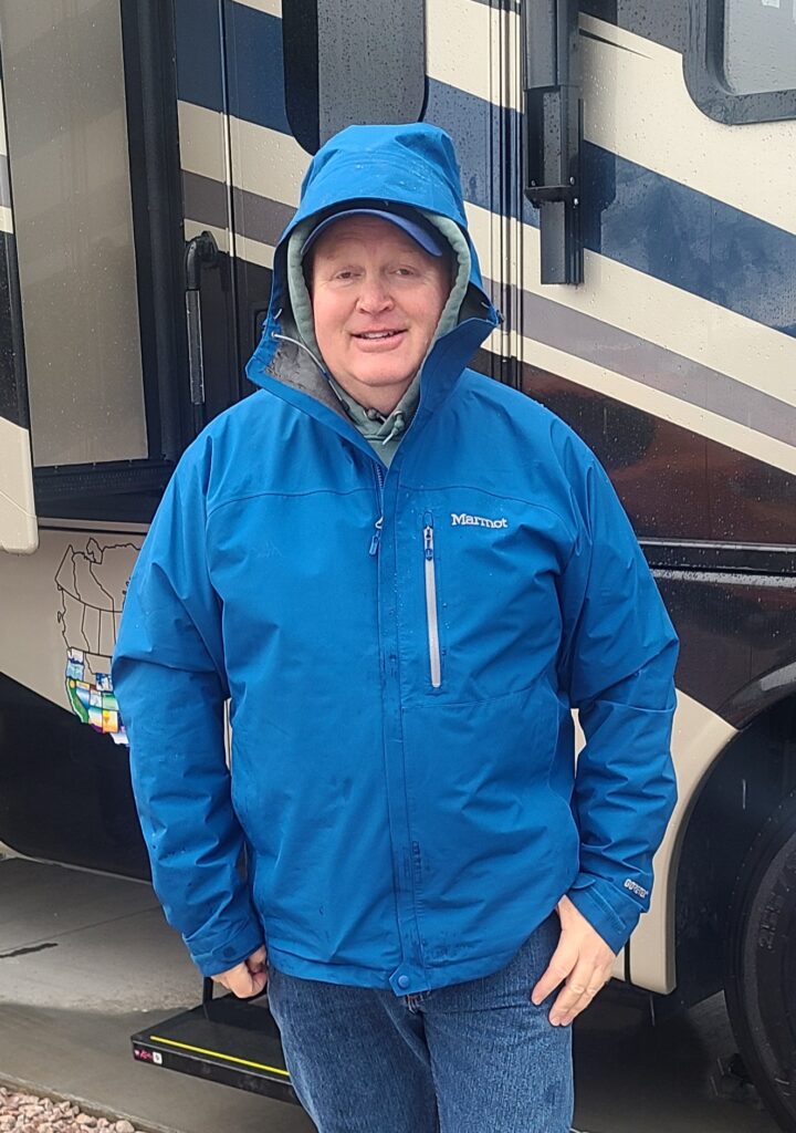 Rob wearing Marmot Minimalist jacket while getting ready to go hiking 