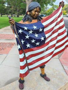 Indian Girl Holding an American Flag