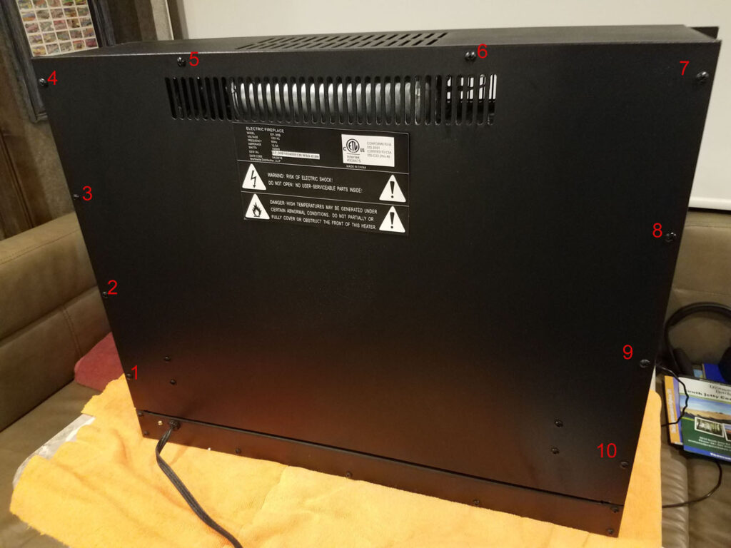 Step 7 Remove the back panel (10 screws along the edge). Be careful—wires connect the motor to the back panel.