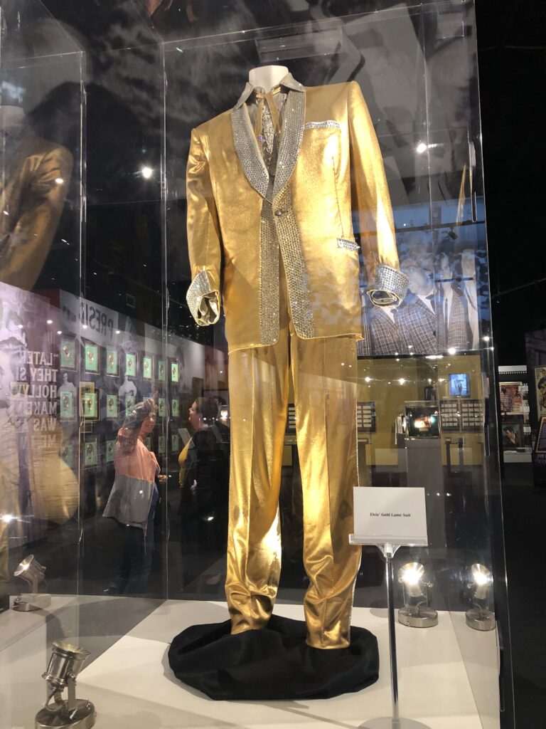 Display case of Elvis Presley stage costumes and gold records at Graceland
