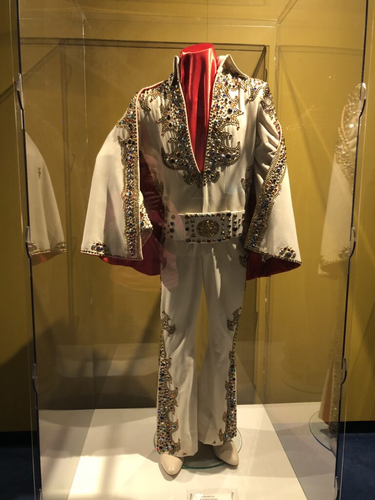 Display case of Elvis Presley stage costumes and gold records at Graceland