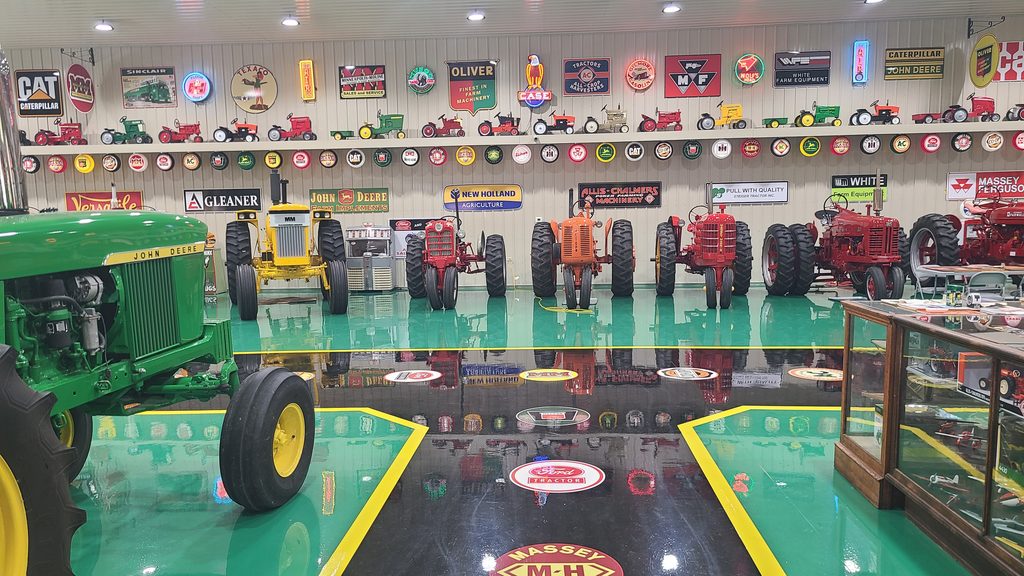 Restored antique tractors inside the Cammack Station collection