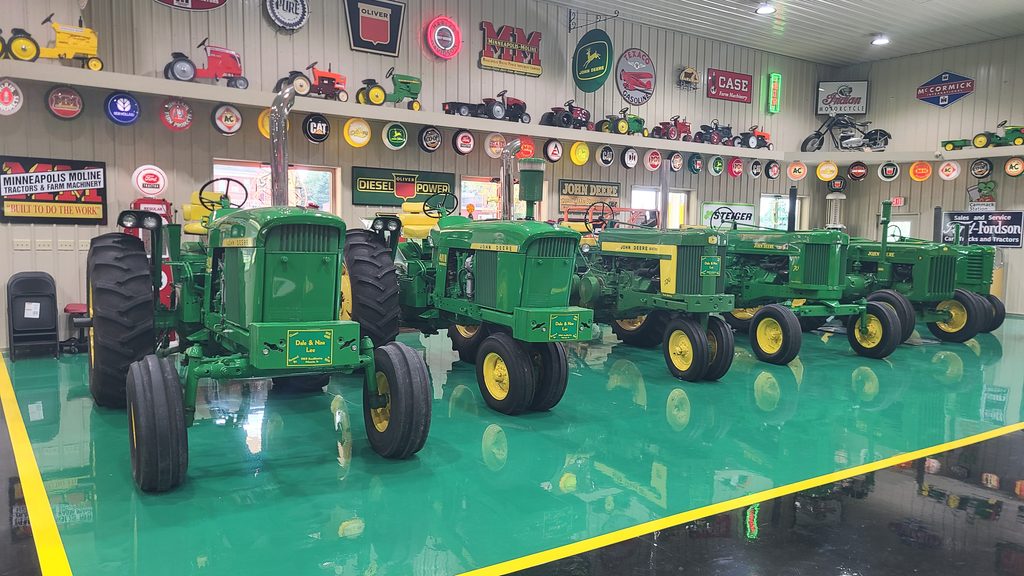 Restored antique tractors inside the Cammack Station collection