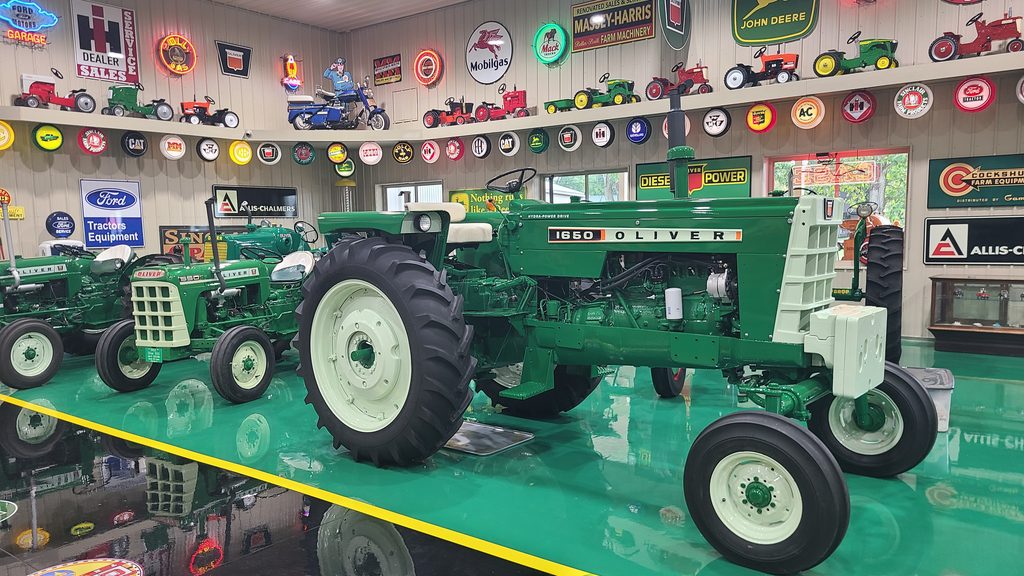 Restored antique tractors inside the Cammack Station collection
