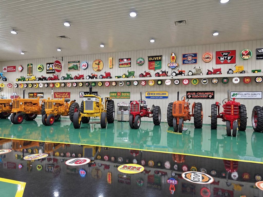 Restored antique tractors inside the Cammack Station collection