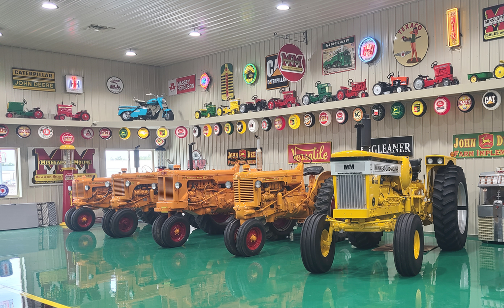 Restored antique tractors inside the Cammack Station collection